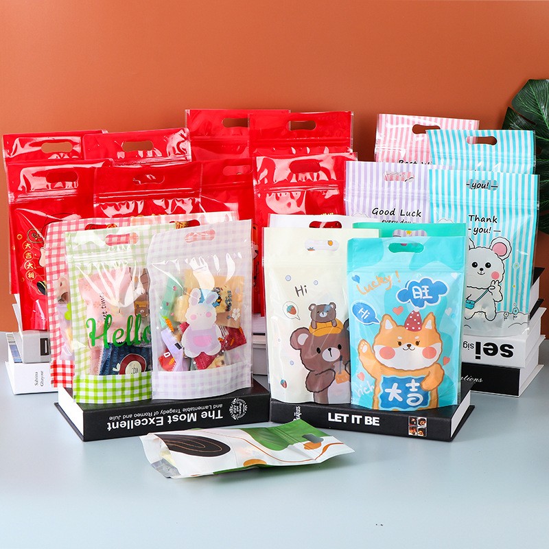 2021年新款休闲食品包装袋可爱卡通自封袋新年喜庆糖果自立袋现货图2