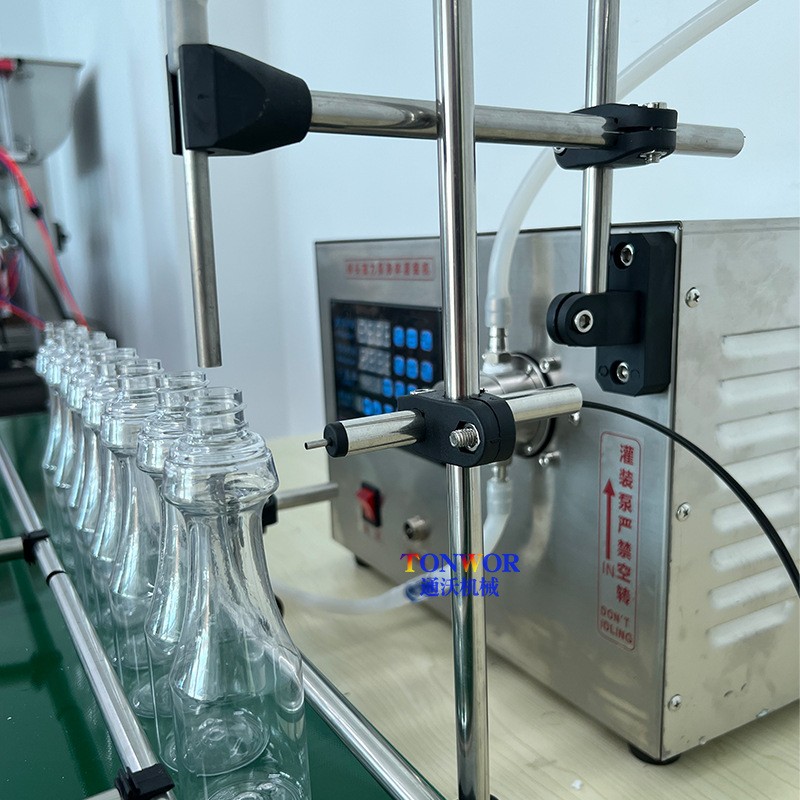 小型液体定量灌装机烟油香水精油白酒西林瓶自动罐装机流水线图3