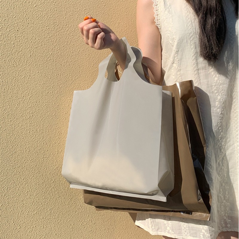 服装店衣服塑料袋子韩风手提购物袋网红男女装时尚礼品袋可印logo图2