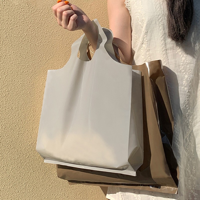 高档圆口服装店手提袋加厚塑料衣服用购物礼品包装打包袋 可批发图3